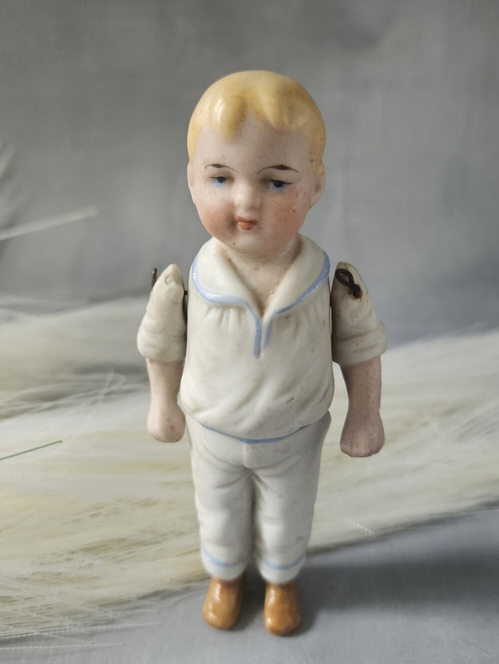 Antique German all-bisque sailor boy doll, highly characteristic of miniature do